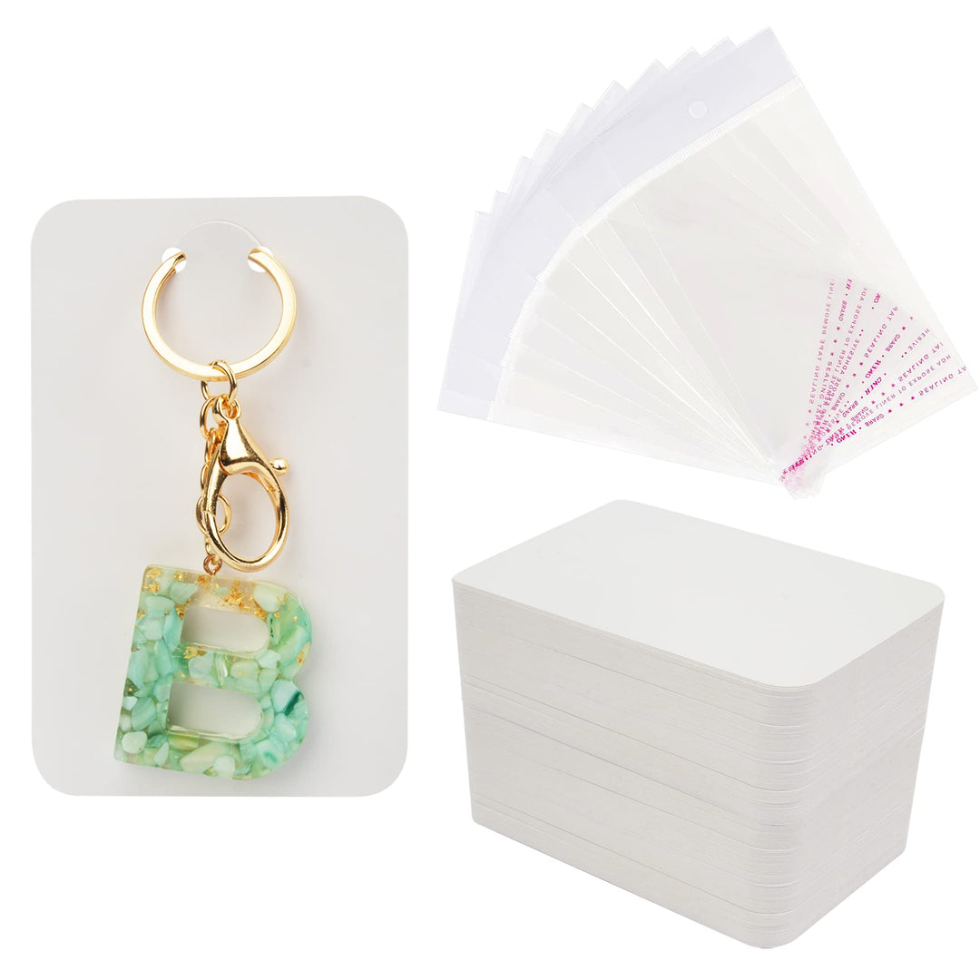 100 Pcs Keychain Display Cards with Self-Sealing Bags, 3'' x 4.7'' Keychain Cards Holder for Display Keyring Cards Jewelry Packaging Supplies (White)