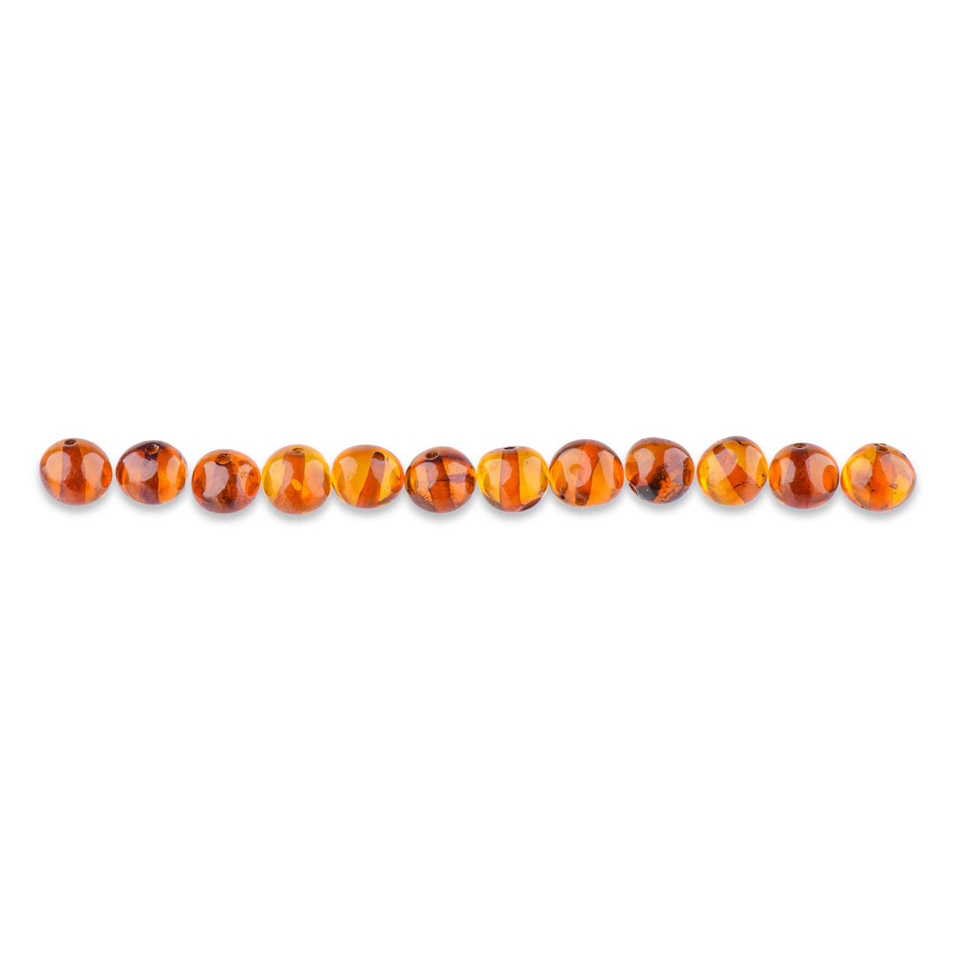- Loose Polished Amber Beads from The Baltic Sea - Drilled Through - 10 Grams - 4-6 mm - Cognac