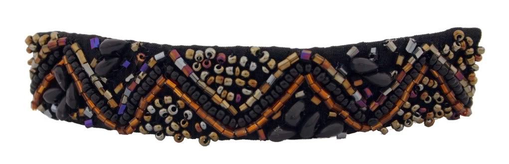 Various Beads Strung Into Shapes On A Tight Holding Volume Barrette In Natural Colors