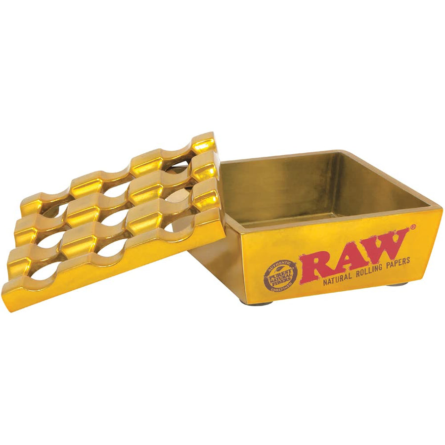 Raw Vanash Windproof Ashtray gold colour with DeLaCruzV Sticker.