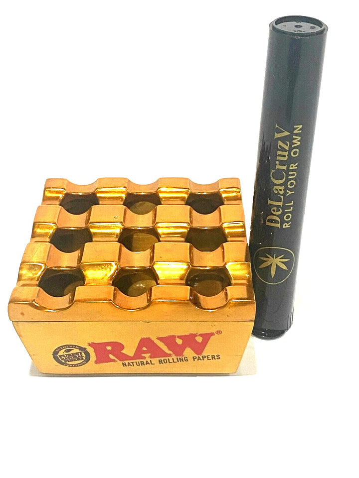 Raw Vanash Windproof Ashtray gold colour with DeLaCruzV Sticker.