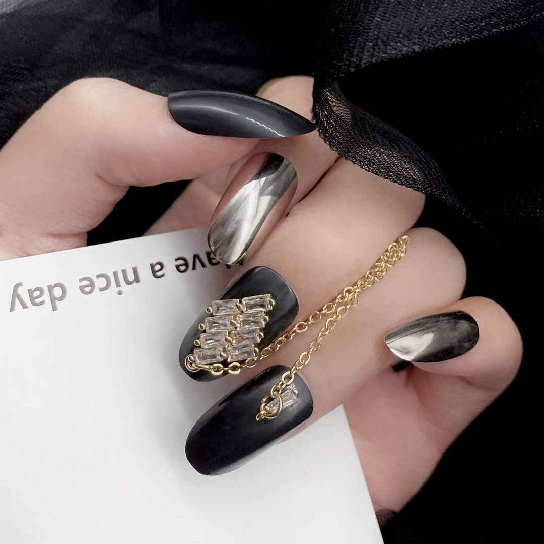 24 Pcs Press on Nails Medium Length,Mirror Fake Nails,Black Gold False Nails with Chain for Women and Girls