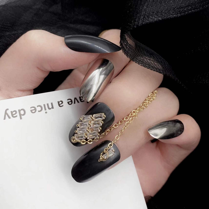 24 Pcs Press on Nails Medium Length,Mirror Fake Nails,Black Gold False Nails with Chain for Women and Girls