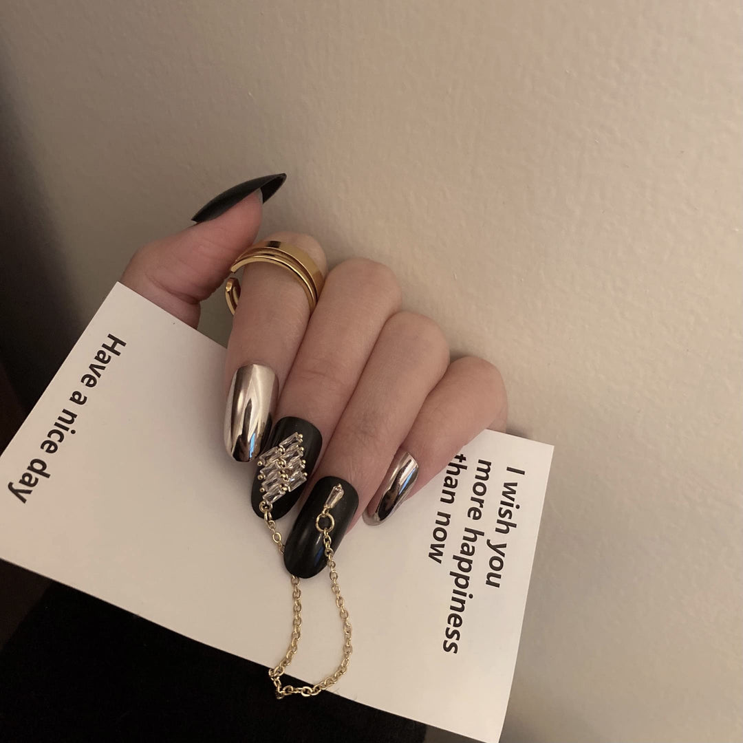 24 Pcs Press on Nails Medium Length,Mirror Fake Nails,Black Gold False Nails with Chain for Women and Girls