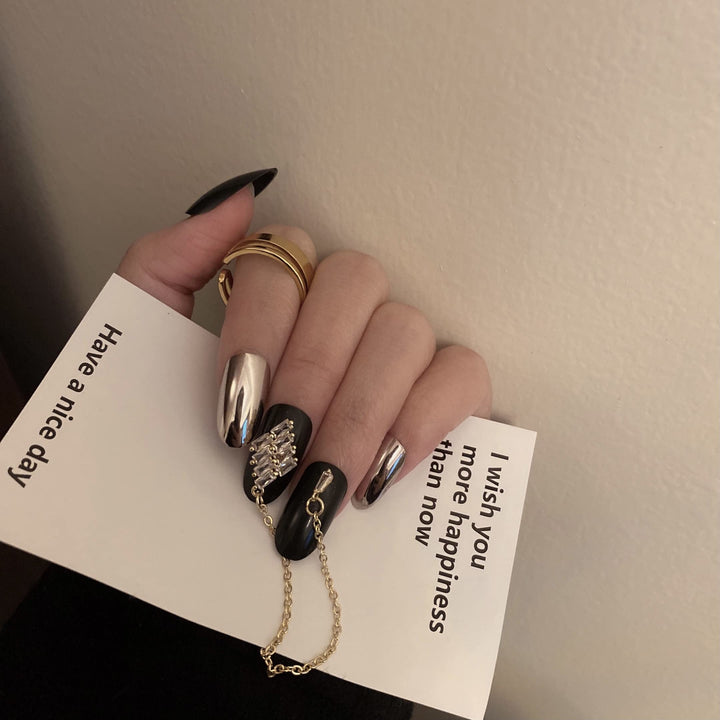 24 Pcs Press on Nails Medium Length,Mirror Fake Nails,Black Gold False Nails with Chain for Women and Girls
